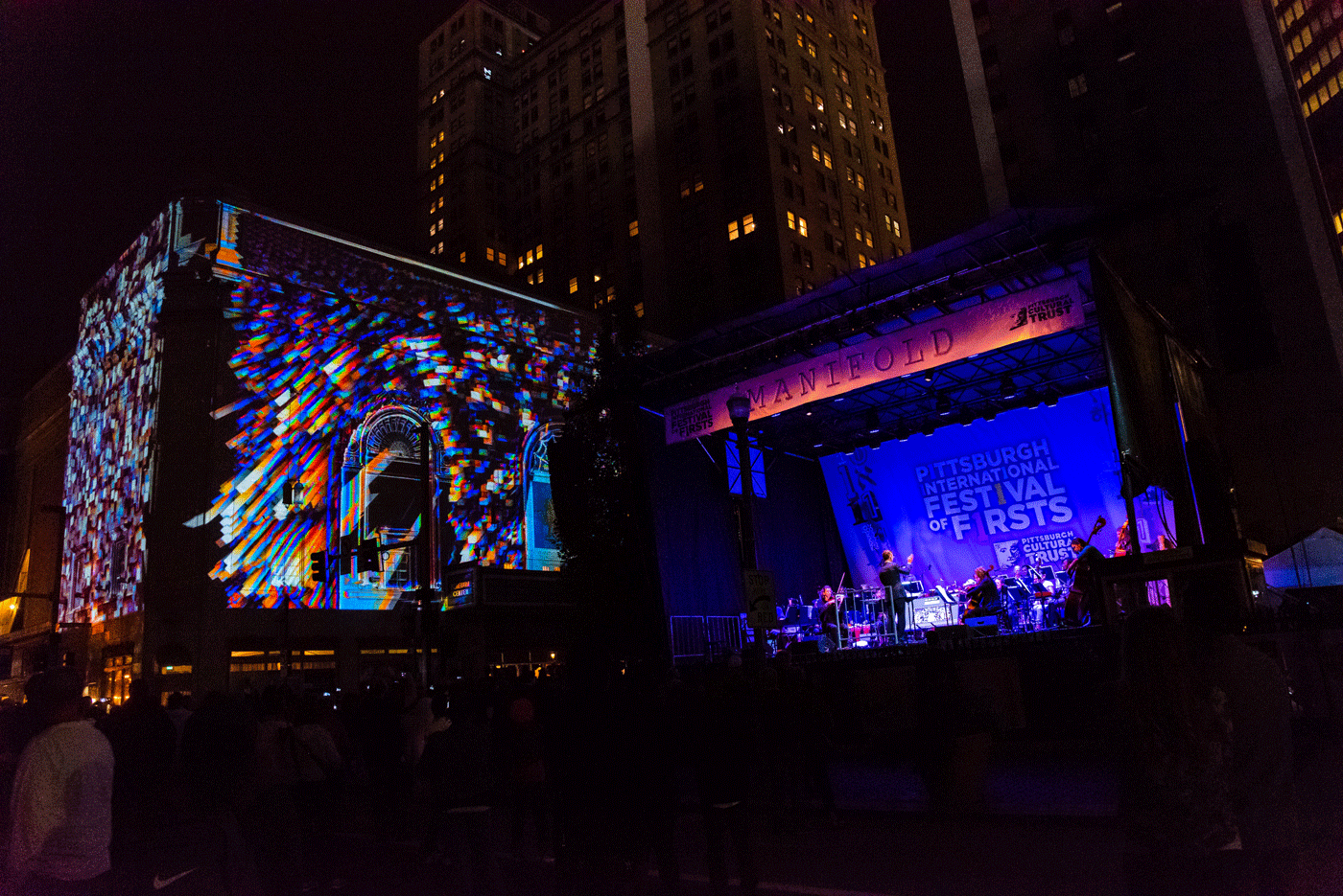 A Symphony Plays On A Stage In Front Of An Illuminated Building